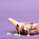 white ceramic figurine on pink surface